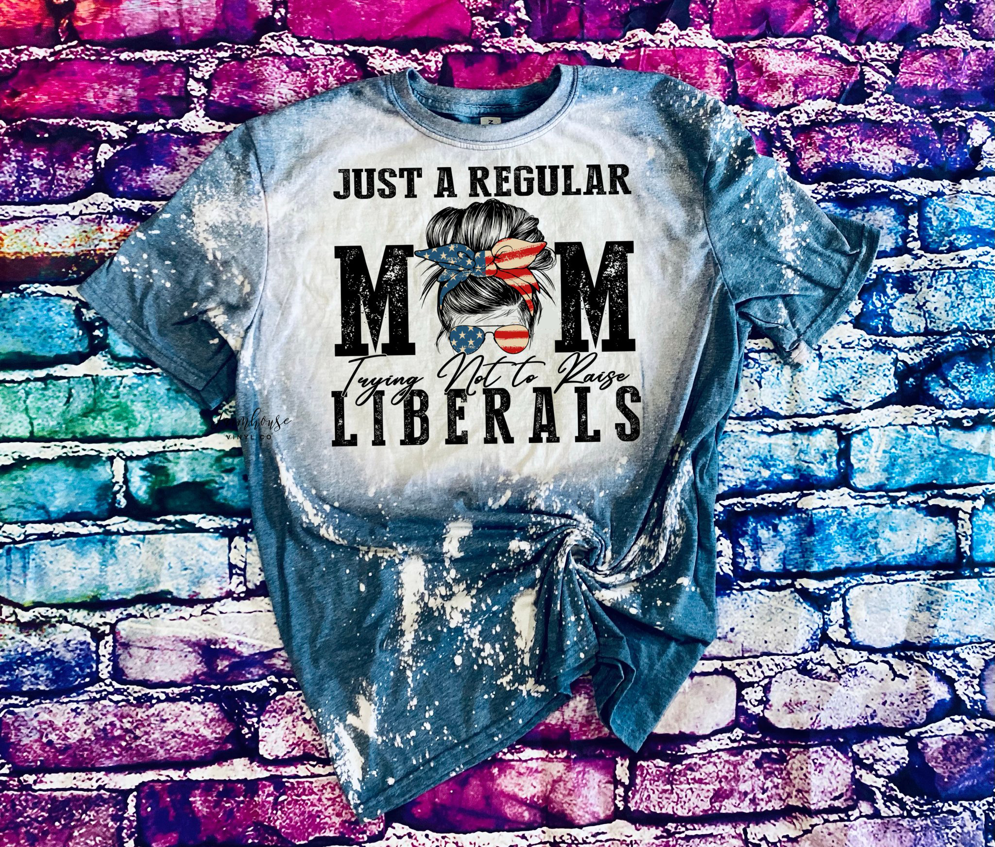 Just a regular mom trying not to raise liberals bleached shirt